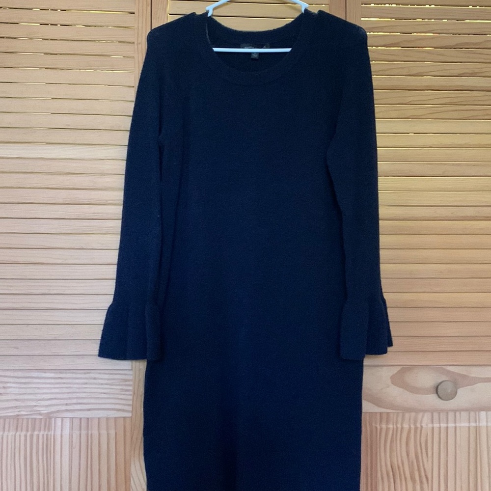 Navy wool blend, long sleeve, small ruffle cuff.